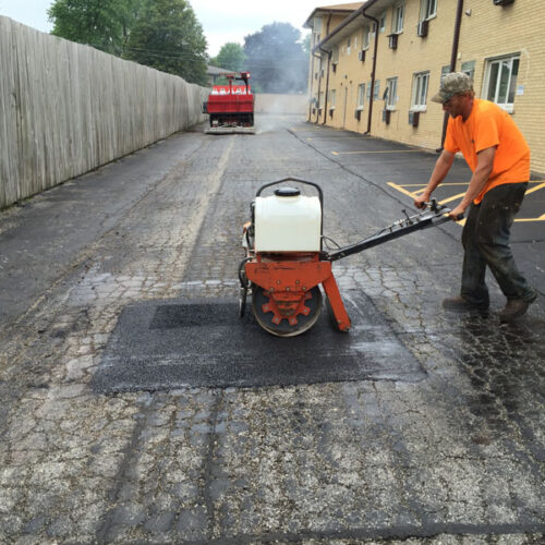 Asphalt patching by one of our asphalt contractors
